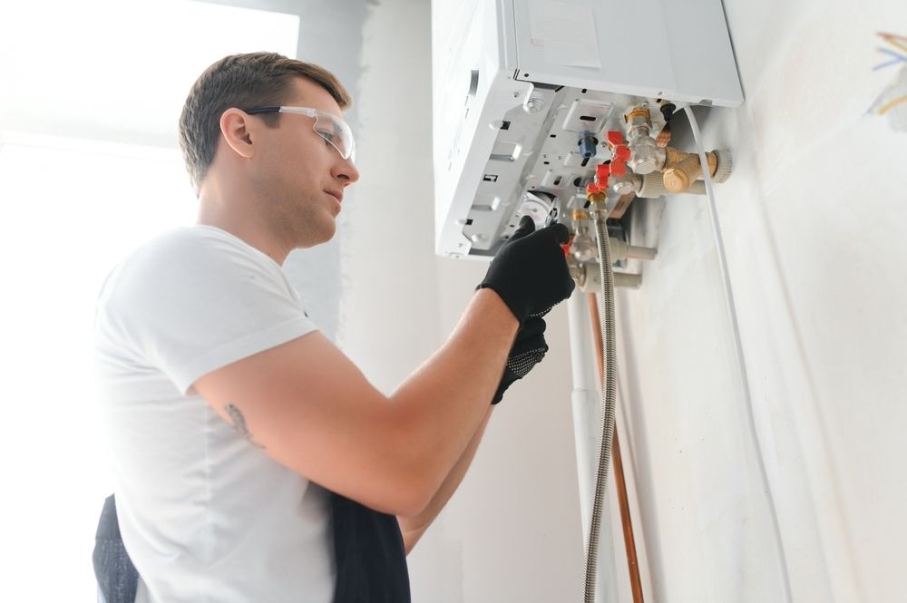 Professional Plumber Checking A Boiler And Pipes, Boiler Service Concept