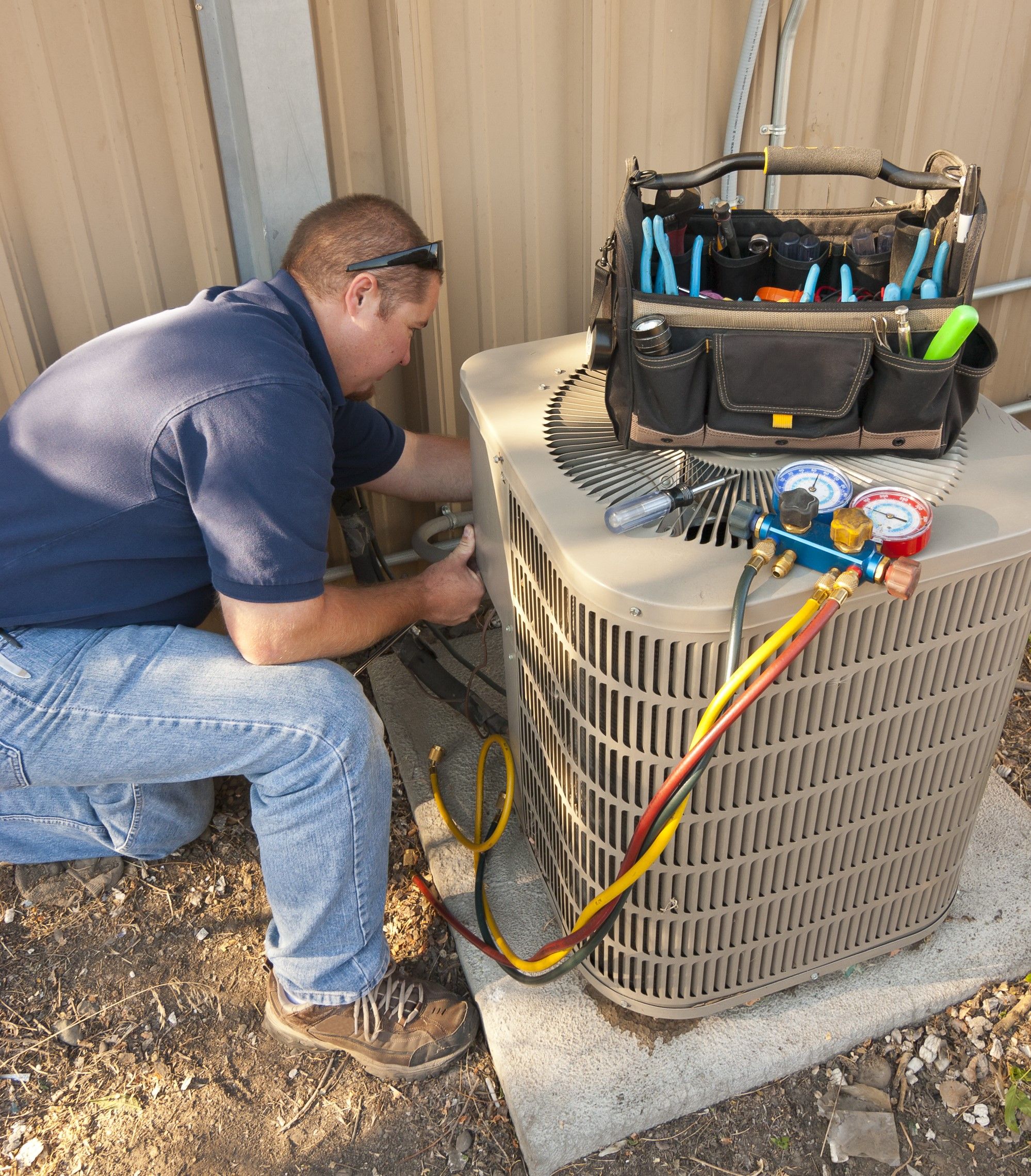 technician fixing ac